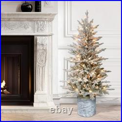 4.5ft Pre-Lit Potted Flocked Arctic Fir Christmas Tree with 70 Clear Lights
