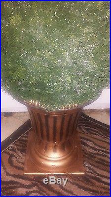 54-Inch Artificial Cedar Spiral Tree with ball in a black and gold urn
