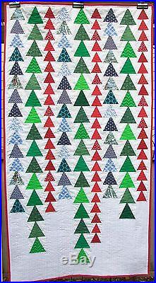 Christmas quilted wall hanging or lap quilt. High impact holiday decor. 38x 72