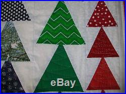 Christmas quilted wall hanging or lap quilt. High impact holiday decor. 38x 72