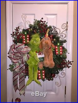 Custom Christmas wreath featuring the Grinch and Max with light-up Presents
