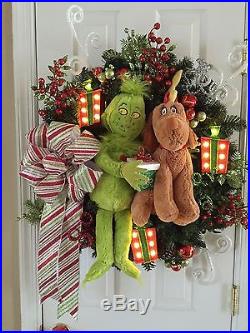 Custom Christmas wreath featuring the Grinch and Max with light-up Presents