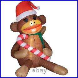 Gemmy 5′ AirBlown Sock Monkey With Scarf Santa Hat Holding Candy Cane Inflatable