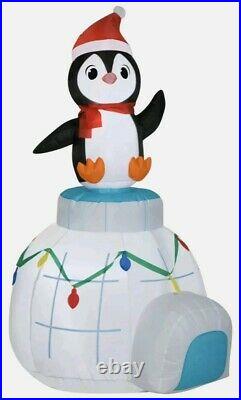Holiday Time 5.5ft Animated Spinning Penguin on Igloo Scene Airblown Inflatable