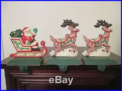 MIDWEST PAINTED CAST IRON SANTA & TWO PINK REINDEER CHRISTMAS STOCKING HOLDERS