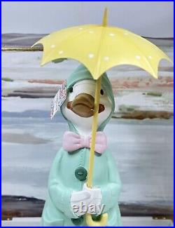 Novogratz Home Spring Easter Duck with Umbrella & Rain Coat Figurine 22′