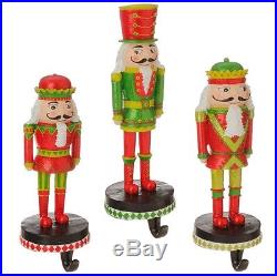 Raz ImportS nutcracker Christmas stocking hanger holder SET of 3 red green
