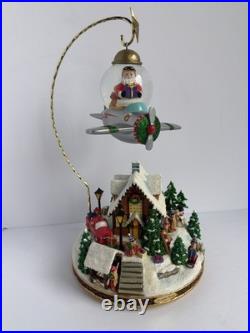 Santa’s Fly by Snowglobe by Christopher Radko Christmas Music Box Airplane