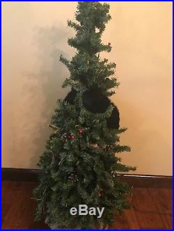 The Hen House Climbing Bear up a Lighted Christmas Tree